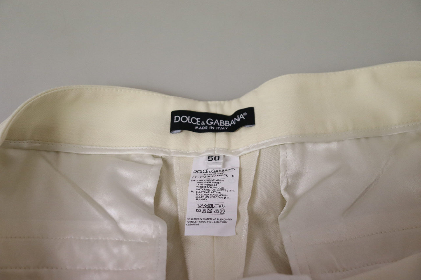 Dolce & Gabbana Elegante elfenbeinfarbene Wollhose mit hoher Taille