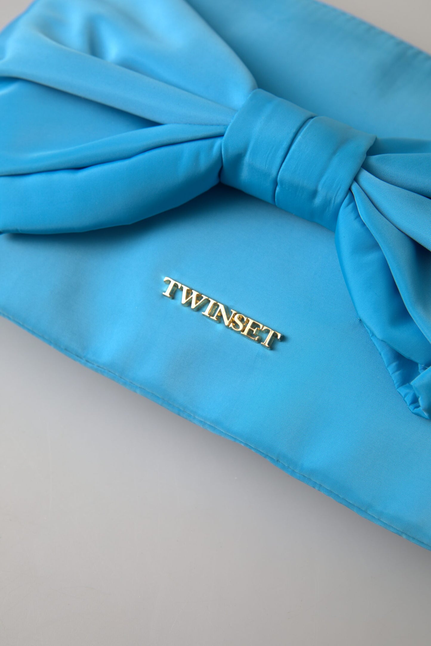 Elegante Seidenclutch von Twinset mit Schleifenakzent