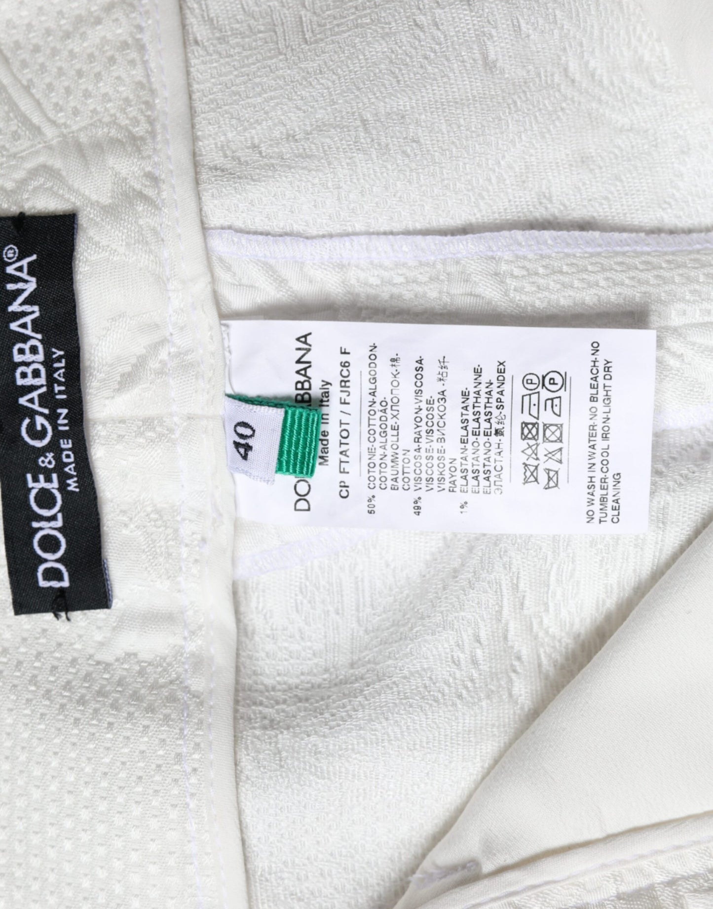 Pantaloni cropped in broccato di cotone floreale bianco Dolce &amp; Gabbana
